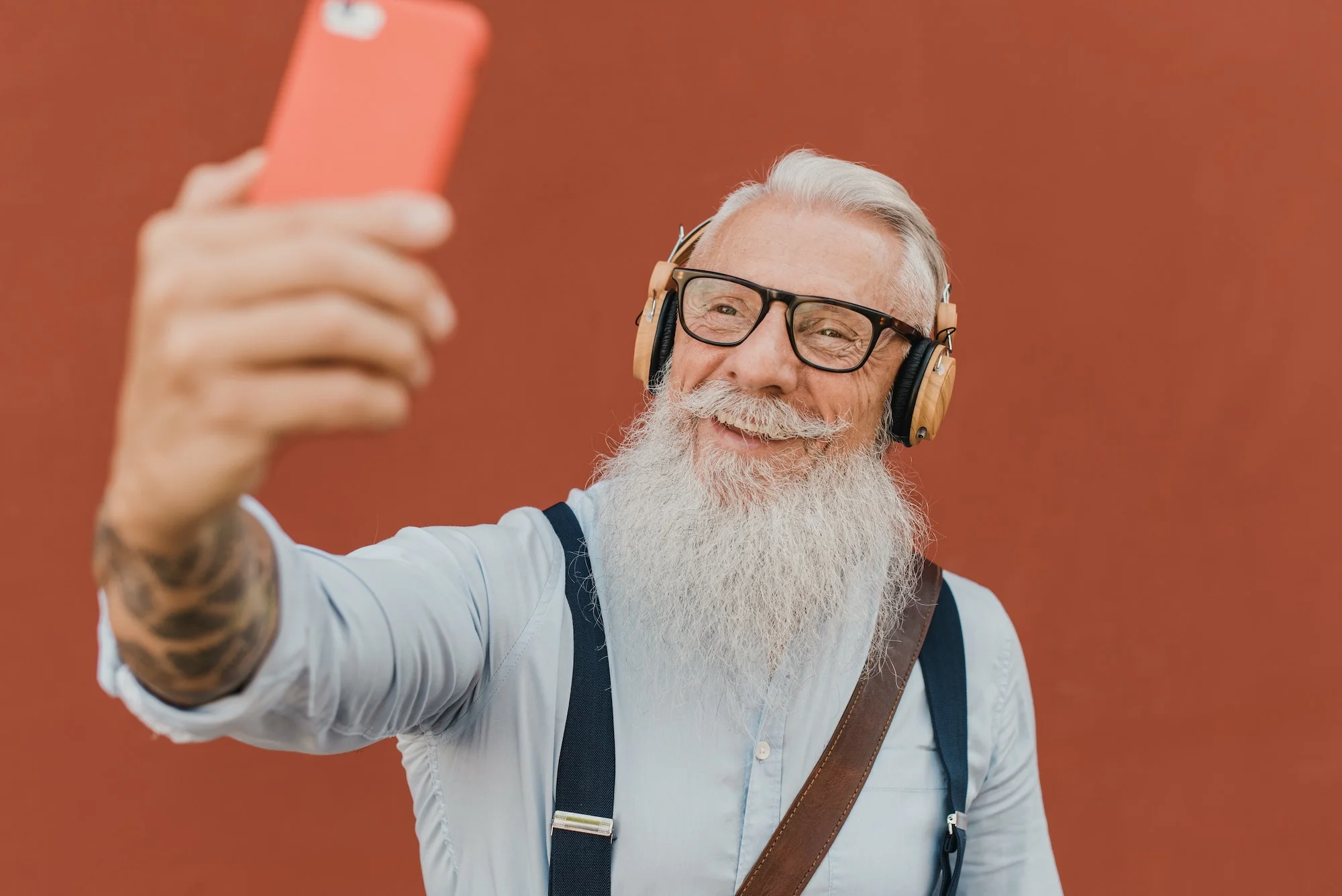 senior man using smartphone for fun